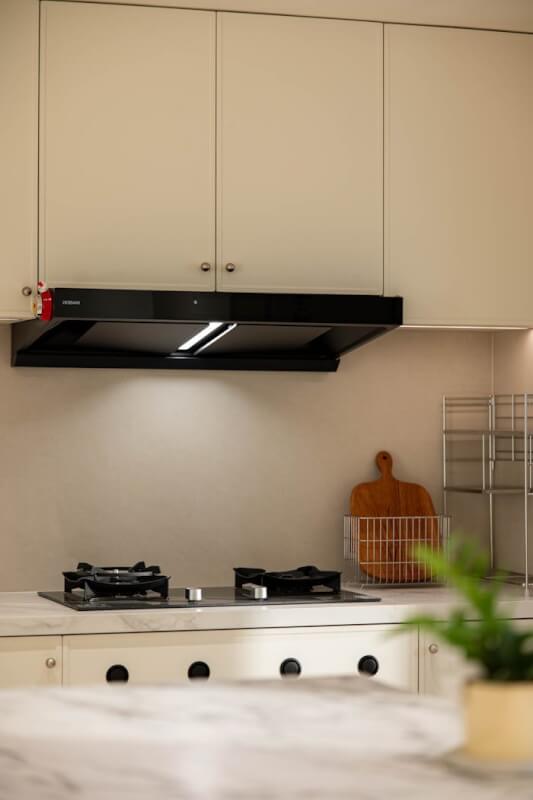 Sleek kitchen interior featuring a gas stove and modern cabinets.